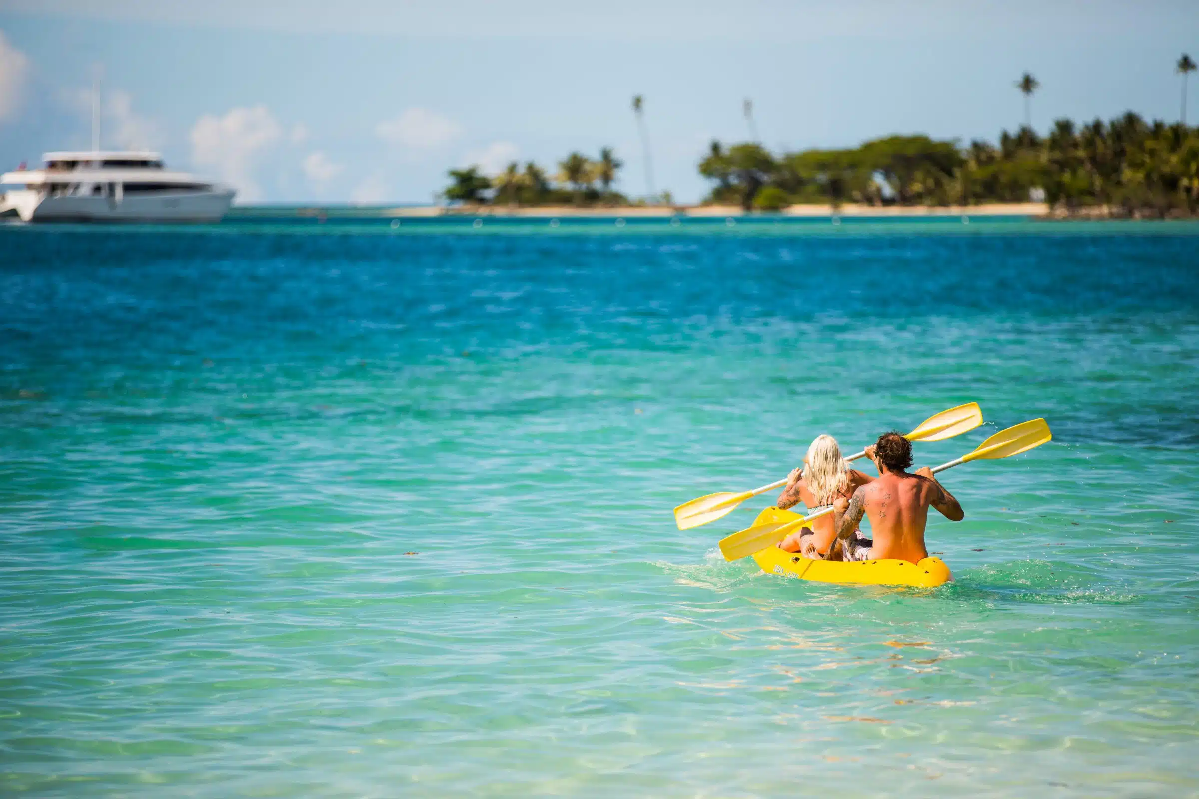A couple riding a kayak in the sea