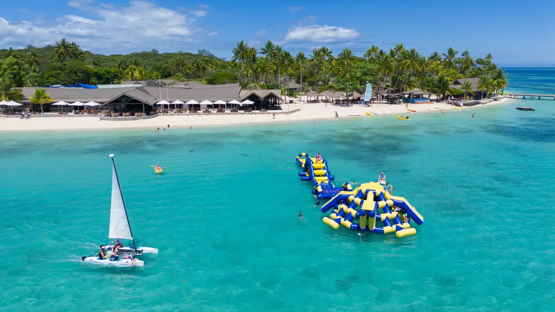 Family water activities and beachfront accommodation at Plantation Island Resort.