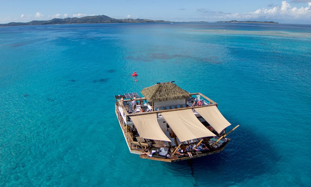 Aerial view of Cloud 9 in the ocean.