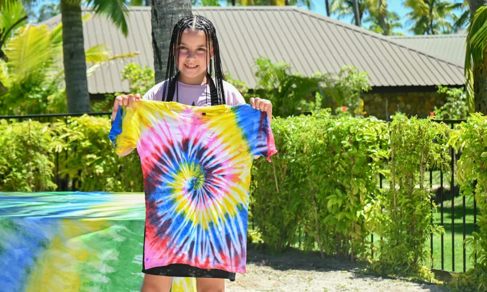 Kids making tie-dye t-shirts at Coconut Kids Club in Fiji